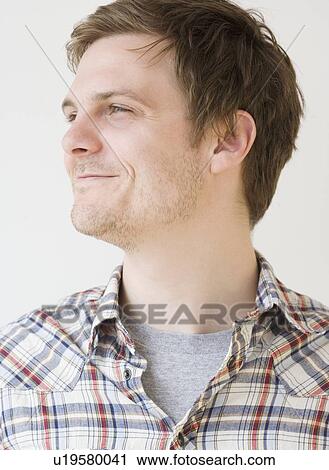 Stock Image - Close up of man smiling. Fotosearch