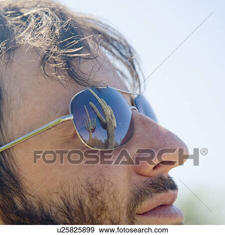 Close up of man wearing sunglasses View Large Photo Image Stock Photo - Close up of man wearing sunglasses. Fotosearch
