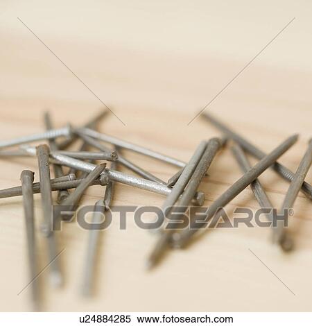 Close up of nails on wood View Large Photo Image Stock Photography - Close up of nails on wood. Fotosearch