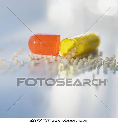 Close up of open medication capsule View Large Photo Image Stock Photo - Close up of open medication capsule. Fotosearch