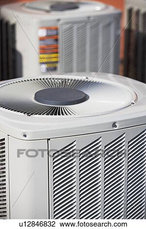 Stock Image - Close up of outdoor air conditioning unit. Fotosearch