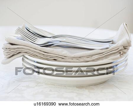 Close up of silverware and napkins on plates View Large Photo Image Stock Image - Close up of silverware and napkins on plates. Fotosearch