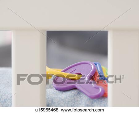 Close up of toy keys in crib View Large Photo Image Stock Photo - Close up of toy keys in crib. Fotosearch