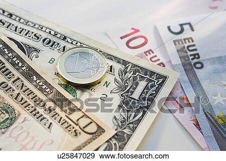 Close up of us dollars and euros View Large Photo Image Stock Photo - Close up of us dollars and euros. Fotosearch