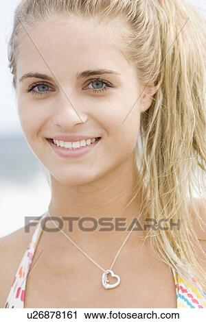 Stock Image - Close up of woman smiling. Fotosearch
