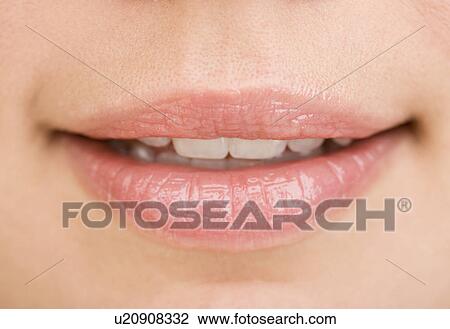 Stock Image - Close up of woman’s mouth. Fotosearch