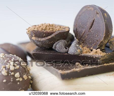 Stock Photo - Closeup of chocolates on cutting board. Fotosearch
