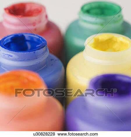 Stock Photo - Closeup of open paint bottles. Fotosearch