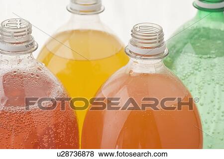 Closeup of open soda bottles View Large Photo Image Stock Photo - Closeup of open soda bottles. Fotosearch