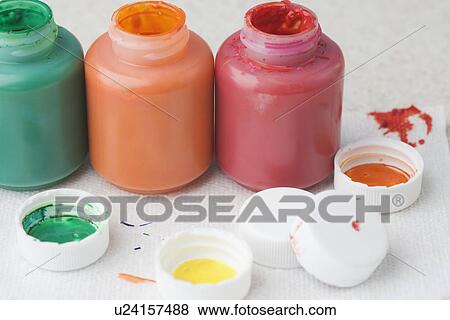 Closeup of paint bottles and lids View Large Photo Image Stock Photo - Closeup of paint bottles and lids. Fotosearch