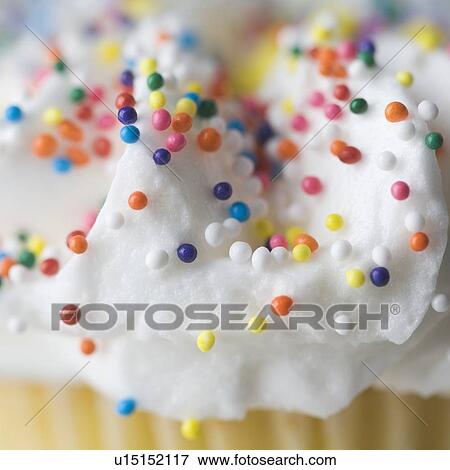 Closeup of sprinkles and frosting View Large Photo Image Stock Photo - Closeup of sprinkles and frosting. Fotosearch