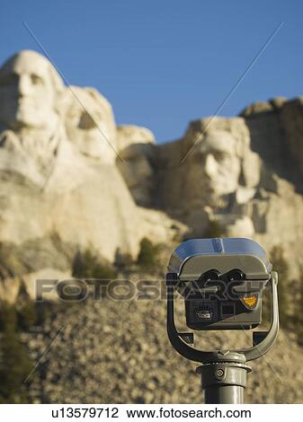 Stock Image - Coin operated binoculars at Mount Rushmore. Fotosearch