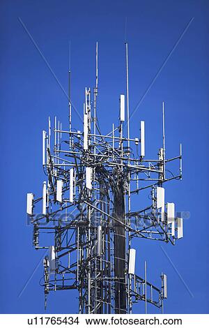 Communications tower under blue sky View Large Photo Image Picture - Communications tower under blue sky. Fotosearch