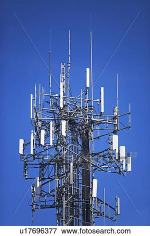 Communications tower under blue sky View Large Photo Image Stock Photo - Communications tower under blue sky. Fotosearch