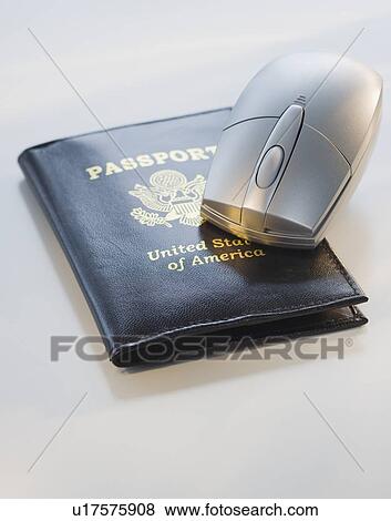 Stock Photo - Computer mouse on passport. Fotosearch