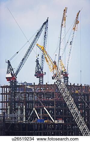Construction site with cranes View Large Photo Image Picture - Construction site with cranes. Fotosearch