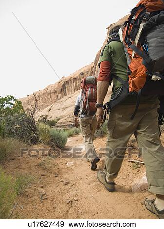 Couple hiking in desert View Large Photo Image Stock Photo - Couple hiking in desert. Fotosearch