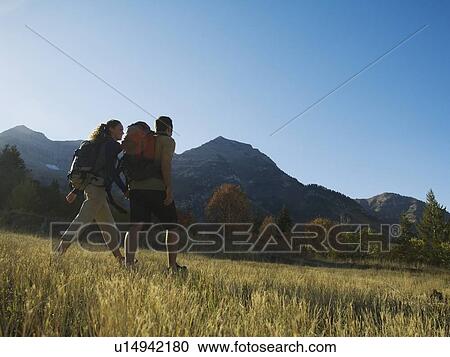 Couple hiking with backpacks, Utah, United States View Large Photo Image Stock Image - Couple hiking with backpacks, Utah, United States. Fotosearch