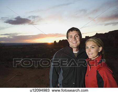 Couple in desert at dusk View Large Photo Image Stock Image - Couple in desert at dusk. Fotosearch