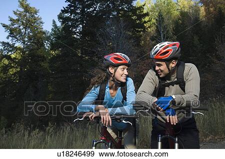 Stock Photo - Couple on mountain bikes, Utah, United States. Fotosearch