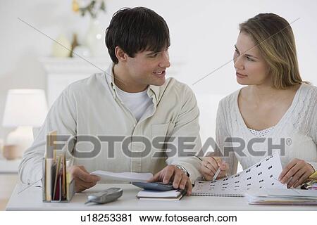 Couple paying bills View Large Photo Image Stock Image - Couple paying bills. Fotosearch