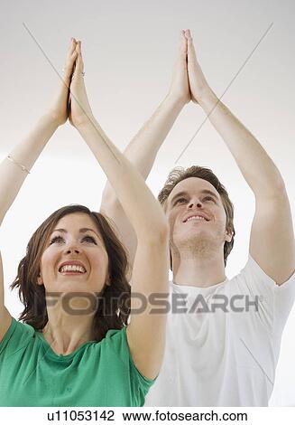 Couple practicing yoga View Large Photo Image Stock Image - Couple practicing yoga. Fotosearch