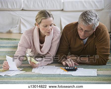 Couple preparing taxes View Large Photo Image Stock Image - Couple preparing taxes. Fotosearch