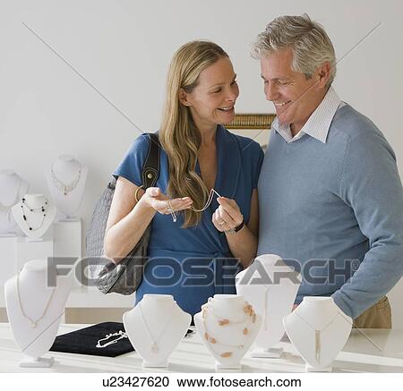 Couple shopping for jewelry View Large Photo Image Stock Image - Couple shopping for jewelry. Fotosearch