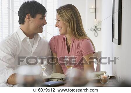 Couple smiling at each other View Large Photo Image Stock Image - Couple smiling at each other. Fotosearch