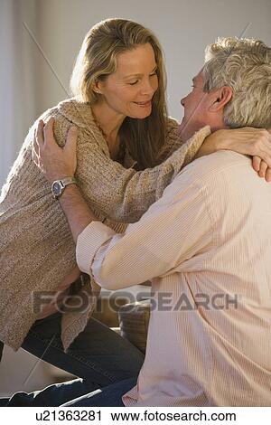 Stock Image - Couple smiling at each other. Fotosearch
