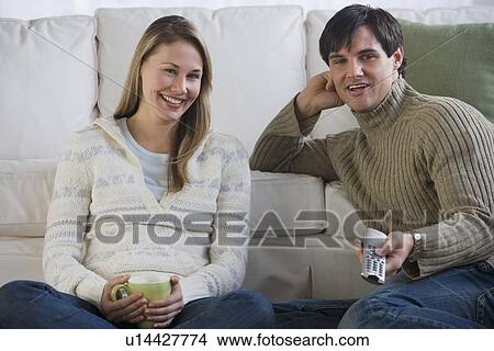 Picture - Couple watching television. Fotosearch