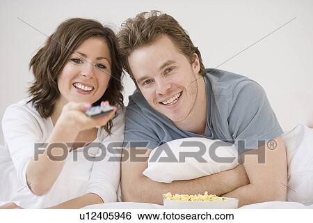 Stock Photograph - Couple watching television. Fotosearch