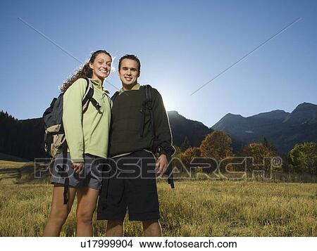 Couple wearing backpacks outdoors, Utah, United States View Large Photo Image Picture - Couple wearing backpacks outdoors, Utah, United States. Fotosearch