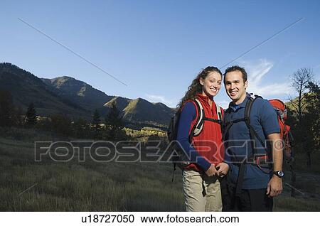 Couple wearing backpacks outdoors, Utah, United States View Large Photo Image Stock Image - Couple wearing backpacks outdoors, Utah, United States. Fotosearch