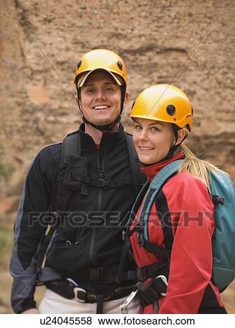 Couple wearing rappelling gear View Large Photo Image Stock Photo - Couple wearing rappelling gear. Fotosearch