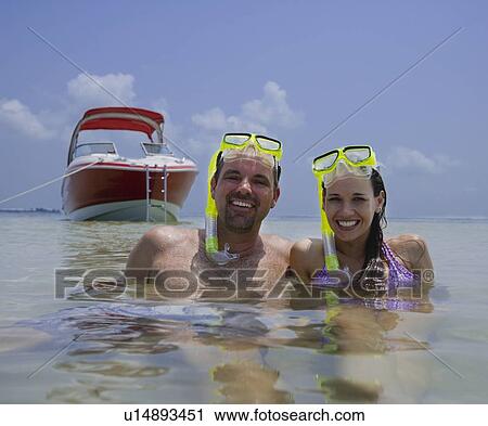 Couple with snorkeling gear in water, Florida, United States View Large Photo Image Stock Image - Couple with snorkeling gear in water, Florida, United States. Fotosearch
