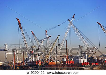 Stock Image - Cranes on dock. Fotosearch