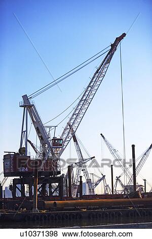 Stock Photo - Cranes on dock. Fotosearch