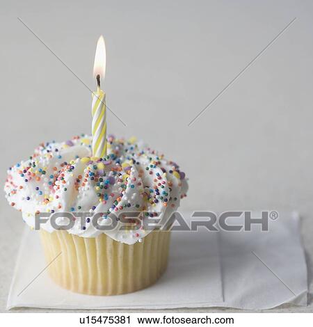 Cupcake with one candle and napkin View Large Photo Image Stock Image - Cupcake with one candle and napkin. Fotosearch