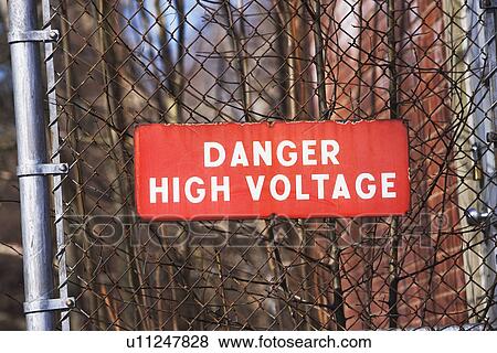 Danger High Voltage sign on fence View Large Photo Image Stock Photo - Danger High Voltage sign on fence. Fotosearch