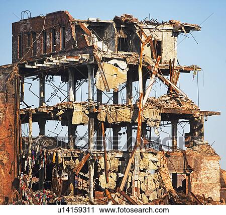Stock Image - Demolished building under blue sky. Fotosearch