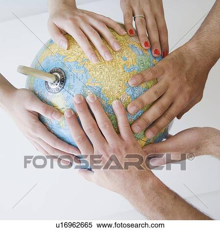 Different hands on globe View Large Photo Image Stock Photography - Different hands on globe. Fotosearch