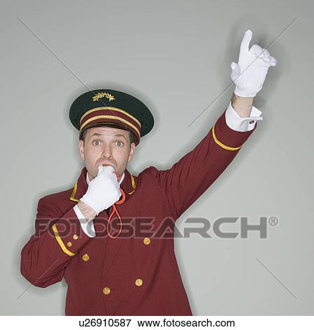 Stock Photo - Doorman blowing whistle and raising arm. Fotosearch