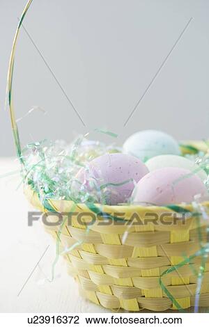 Easter eggs in a basket View Large Photo Image Stock Image - Easter eggs in a basket. Fotosearch