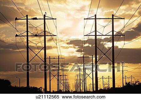 Electrical poles and wires at sunset View Large Photo Image Stock Photography - Electrical poles and wires at sunset. Fotosearch