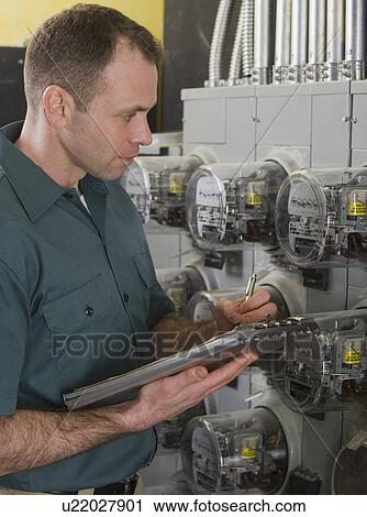 Electrician reading meters View Large Photo Image Stock Image - Electrician reading meters. Fotosearch