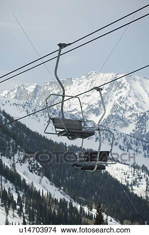 Picture - Empty chair lift gondolas. Fotosearch
