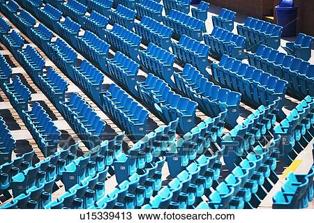 Stock Image - Empty outdoor arena seating. Fotosearch