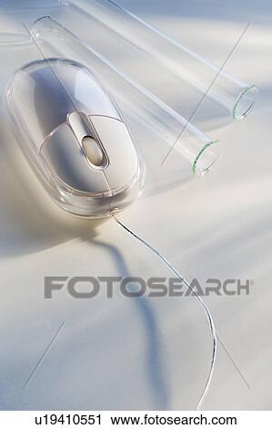 Stock Image - Empty vials next to computer mouse. Fotosearch