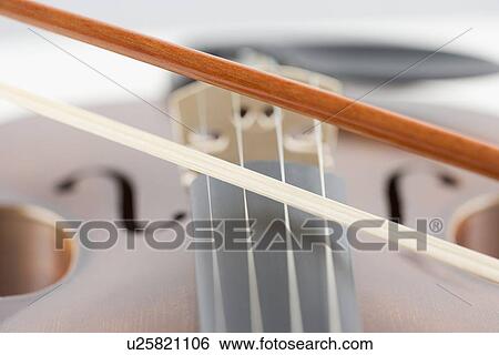 Stock Photograph - Extreme closeup of violin and bow. Fotosearch